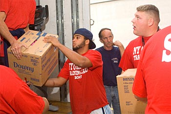 Colin Simmons helping the NY Giants move into their UAlbany summer home