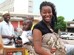 UAlbany student Courtney Ann Hubbard having fun with a friend's baby in Kumasi, Ghana.