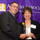 Alumni Association President Jeff Luks '91, '01 presents the Distinguished Alumni Award to Sharon Dawes '72, '91 