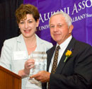 Longtime UAlbany Football coach Bob Ford receives the Citizen of the University Award from Officer in Charge Susan Herbst.
