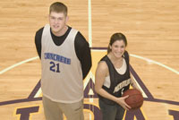 Tim Ferguson, a senior, and Melissa Nappi, a junior, are part of the Midnight Basketball League at UAlbany