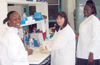 Students and police scientist Debbie McKillop work in biology/NERFI DNA laboratory.