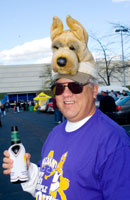 Bill Bubniak, UAlbany Class of 1972, displays Great Dane pride on his hat, on his shirt, and in his hand.