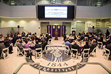 Photo from President's Breakfast in the atrium of University Hall. 80 participants are seated as University President Havidán Rodríguez speaks at podium.