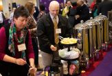University employees help themselves to coffee and tea at the breakfast reception