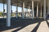 The tall white pillars and arched roof sections of the academic Podium at UAlbany's Uptownn Campus