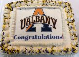 A cake with the UAlbany logo and the word 