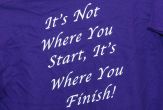 A purple T-shirt with white letters reading: 