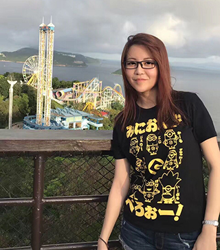 Lin Zho pauses on a hiltop overlooking Ocean Park in Hong Kong in 2017