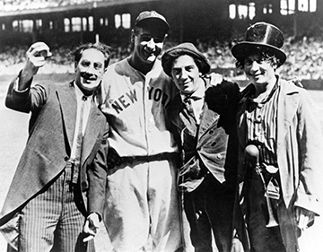 Lou Gehrig, in uniform at the Stadium, poses with the Marx Brothers (in their uniforms)