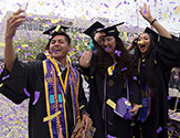 Students celebrate as confetti falls at UAlbany's 2018 undergraduate commencement ceremony.