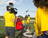 Nyasha, Melick and Sharinel meet President Havidán Rodríguez at Tom & Mary Casey Stadium during the filming of Ellen's docuseries.