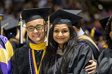UAlbany graduate students take photo at their commencement. 