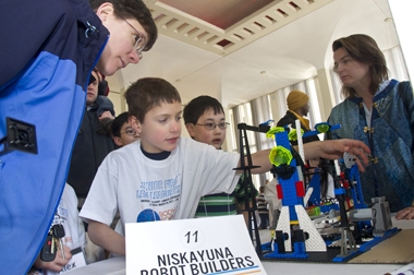 Team members with Lego construction at Junior FIRST Lego League Expo at UAlbany