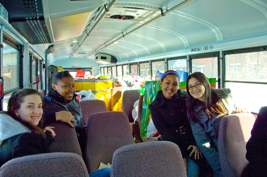 UAlbany students deliver a busload of gifts