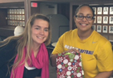 UAlbany softball players wrap presents for Adopt-a-Family
