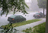 Photo of cars on the road during severe hailstorm.