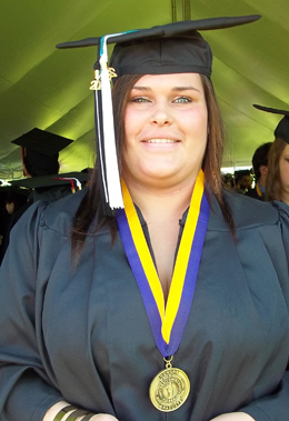 Brittni Gulotty, in her cap and gown at Commencement