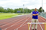 Coach Roberto Vives, at home away from home, on the University at Albany track