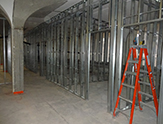 The old Health Center (Building 25): Installation of steel wall studs and rough-in electrical.  