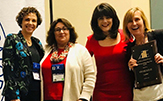 Jerry Rivera-Wilson, second from right, poses with her winning team at the Association of Teacher Educators convention