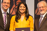 Hirah Mir accepts an award.