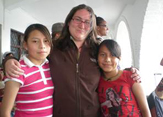 Aline Heffernan with children in Ecuador