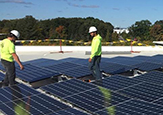 Solar panels being installed at the Campus Center West addition.  