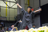 A grad celebrates during Winter Commencement 2015. (Photo by Mark Schmidt)