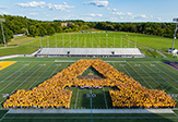 UAlbany’s Class of 2021 and new transfer students form a giant “A” on Bob Ford Field.
