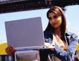 Woman using a laptop outside in New York City