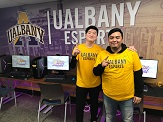 UAlbany eSports teammates Jin Long Shi and Aldair Hernandez inside competitive video-gaming arena at Draper Hall.