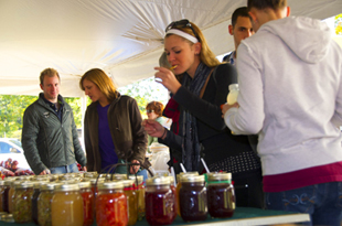 A patron enjoys some samples at the foodtasting during Fallbany in 2010