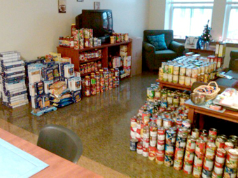 Circle K students stock an apartment full of food ready to deliver for the holidays