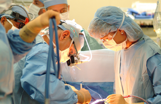 Doctors perform surgery.