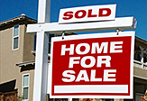 For Sale sign in front of a property