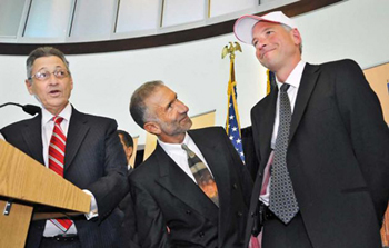 State Assembly Speaker Sheldon Silver and College of Nanoscience and Engineering Senior Vice President and CEO Alain Kaloyeros present Sematech president and CEO Dan Armbrust with an I LOVE NY hat