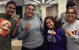 Students hold MASH discount cards.