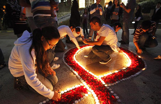 Students prepare a memorial in honor of AIDS victims for World AIDS Day