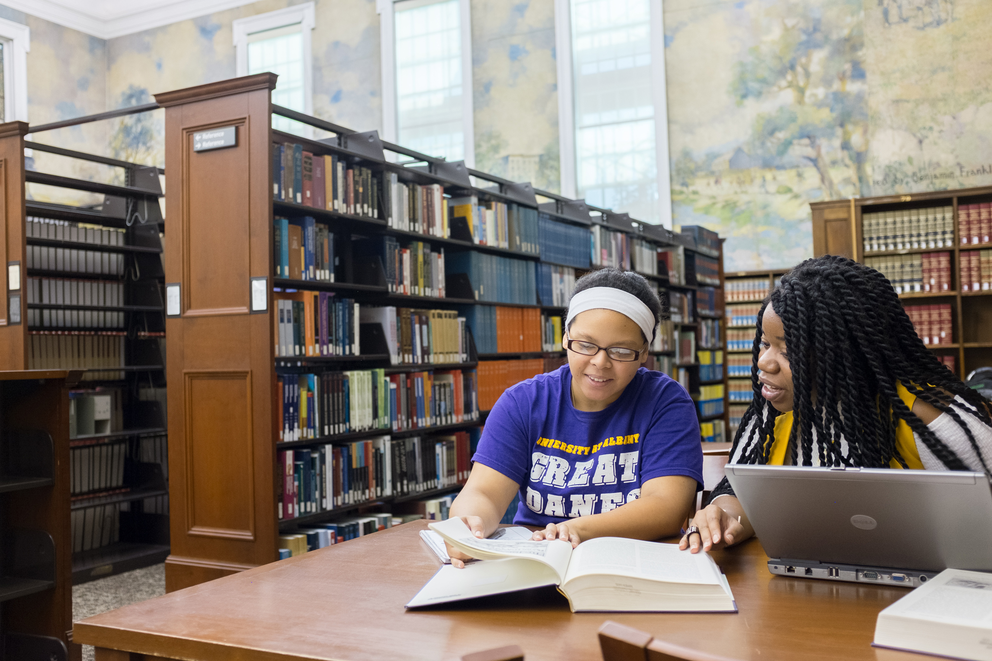 Two students studying in the Dewey Library
