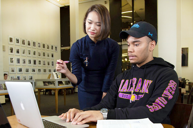 Two students studying in the UAlbany library