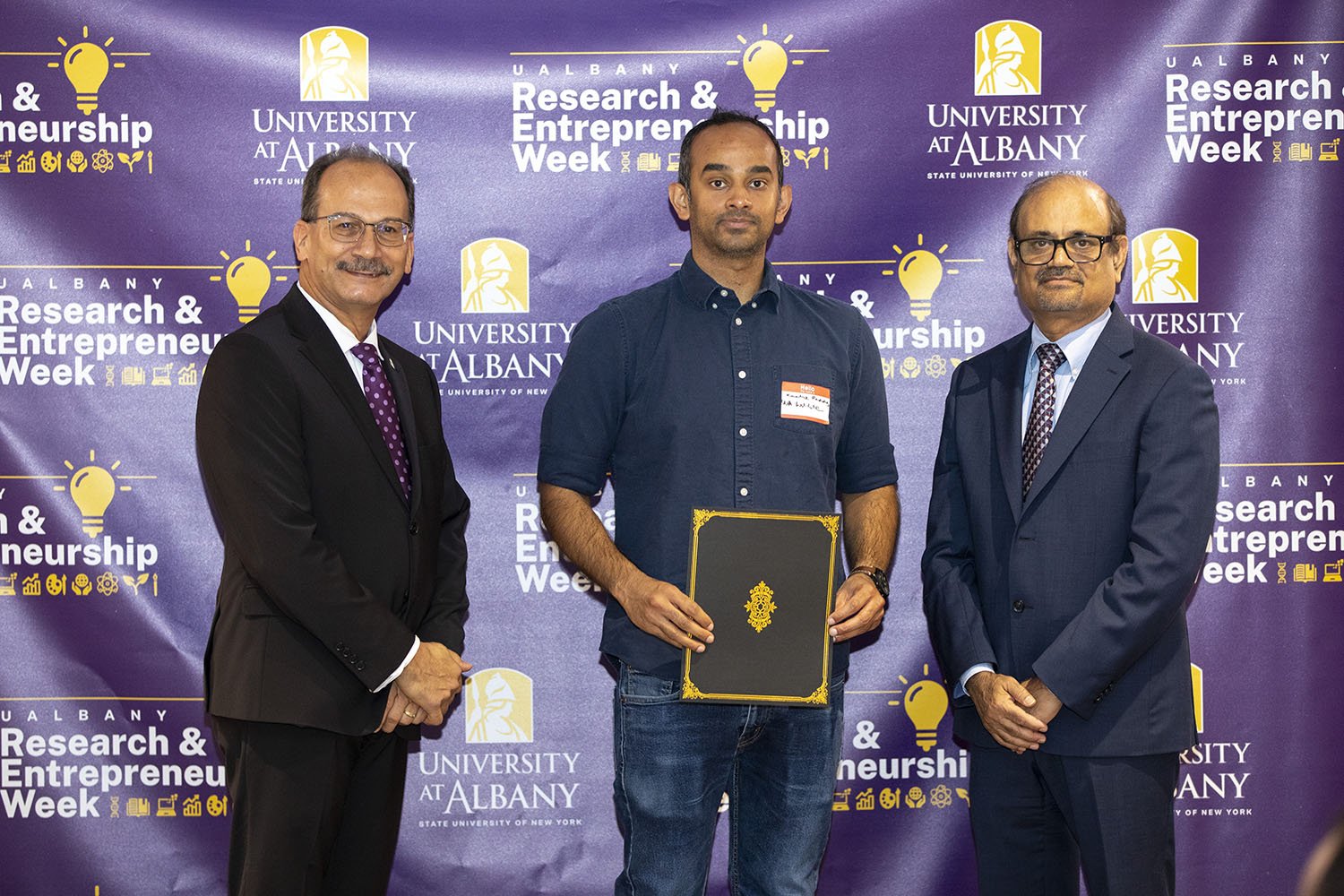 Kaalak Reddy, The RNA Institute, with UAlbany President Havidán Rodríguez and Vice President for Research and Economic Development Thenkurussi “Kesh” Kesavadas.