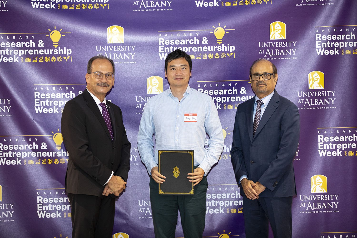 Qiang Zhang, Chemistry, with UAlbany President Havidán Rodríguez and Vice President for Research and Economic Development Thenkurussi “Kesh” Kesavadas.
