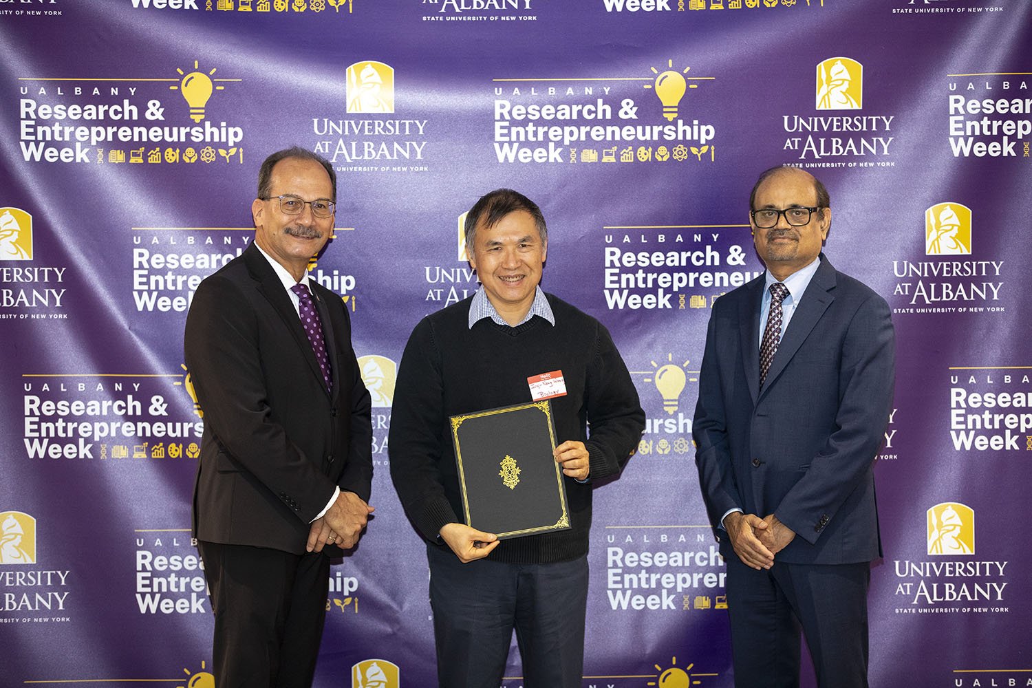 Ing-Nang Wang, Biological Sciences, with UAlbany President Havidán Rodríguez and Vice President for Research and Economic Development Thenkurussi “Kesh” Kesavadas.