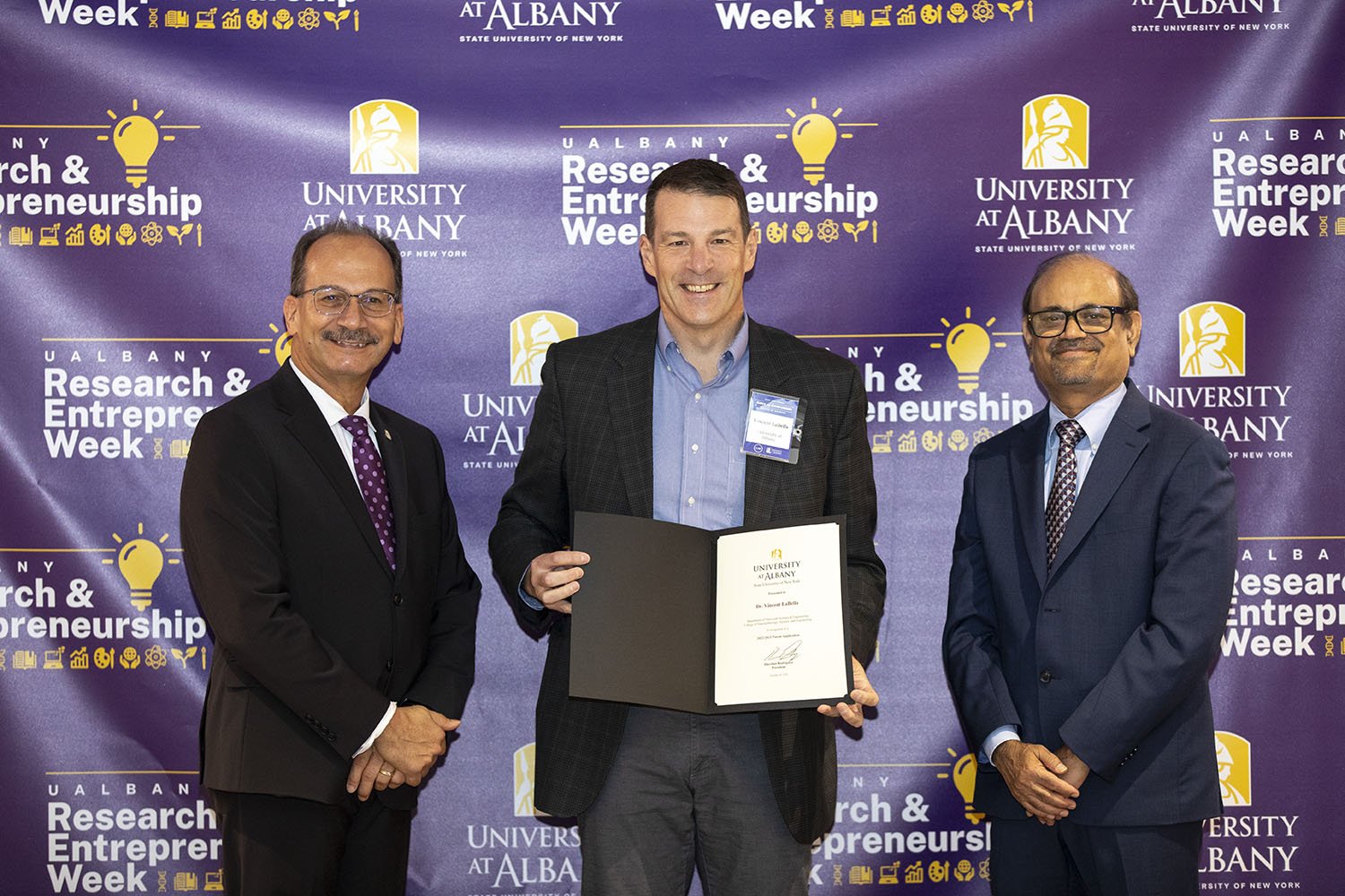 Vincent LaBella, CNSE, with UAlbany President Havidán Rodríguez and Vice President for Research and Economic Development Thenkurussi “Kesh” Kesavadas.