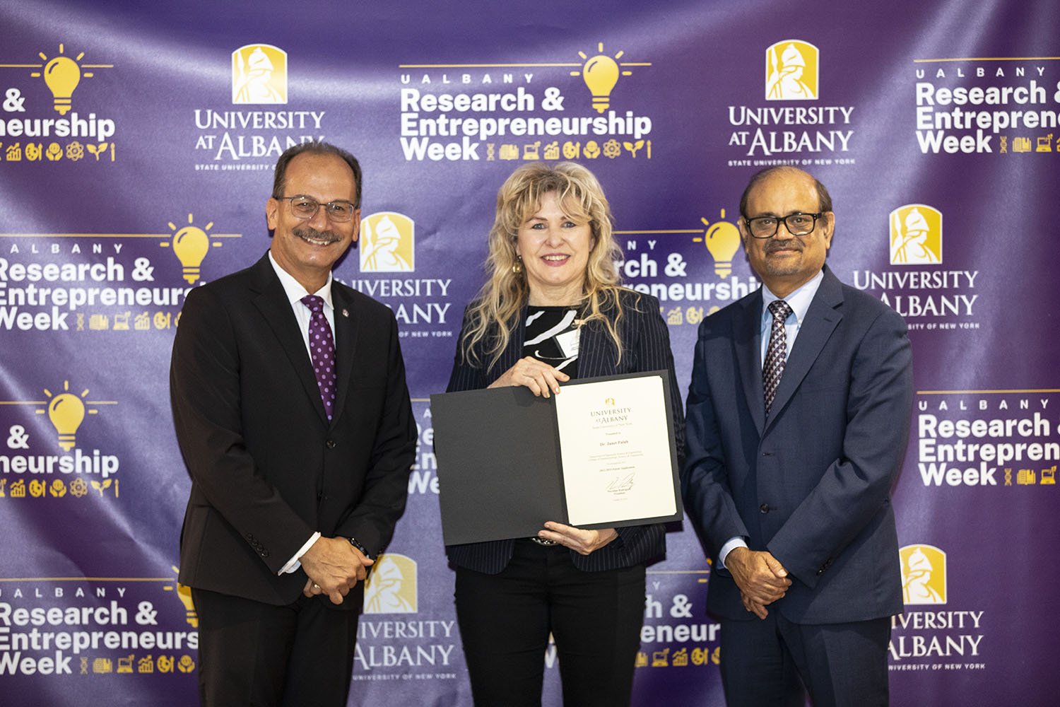 Janet Paluh, CNSE, with UAlbany President Havidán Rodríguez and Vice President for Research and Economic Development Thenkurussi “Kesh” Kesavadas.