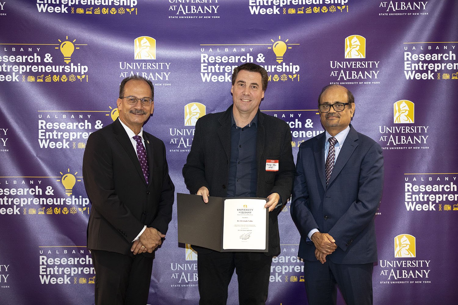 Christophe Vallée, CNSE, with UAlbany President Havidán Rodríguez and Vice President for Research and Economic Development Thenkurussi “Kesh” Kesavadas.