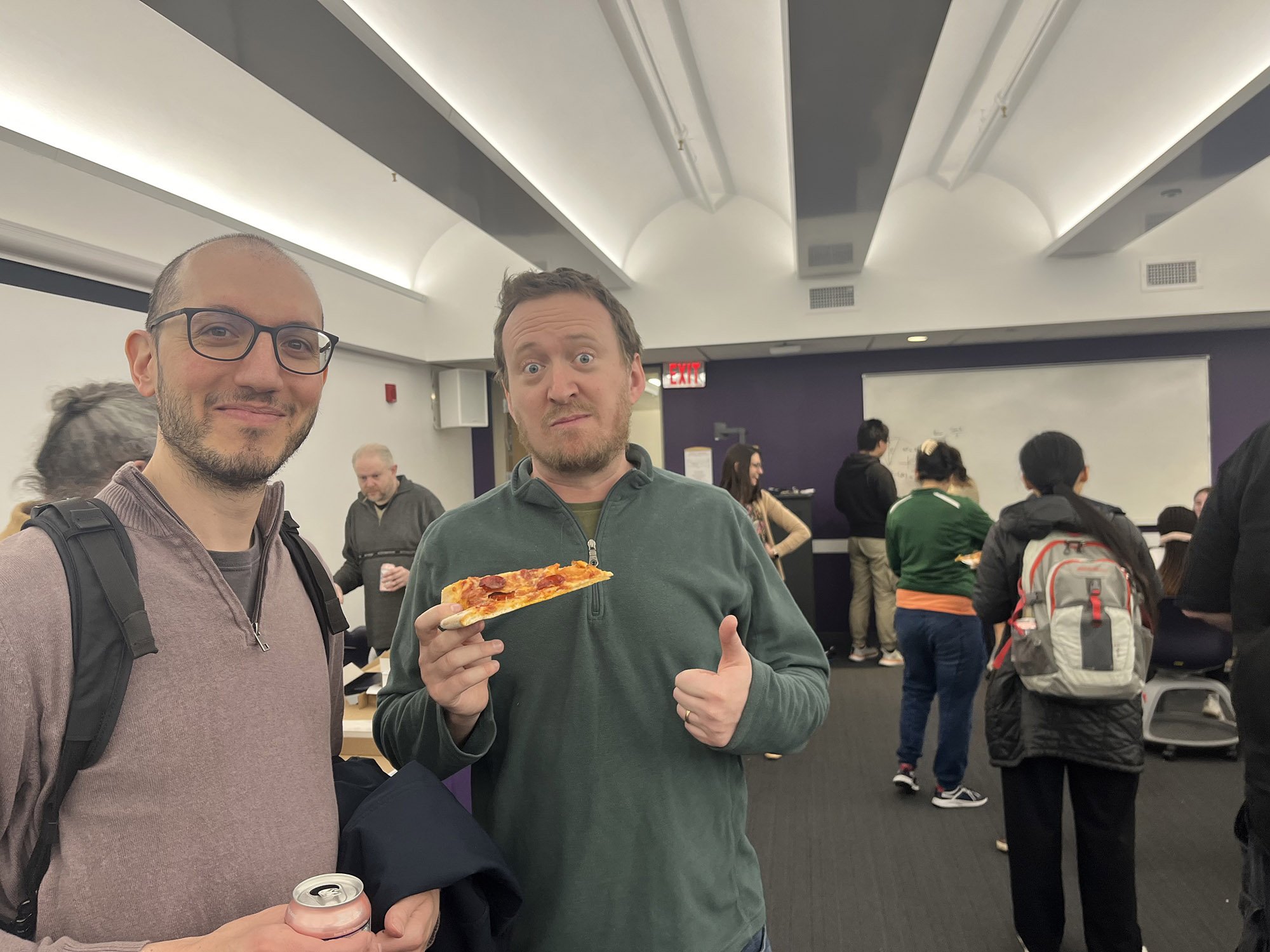 Faculty and staff from UAlbany's Department of Mathematics and Statstics celebrates Pi Day on March 14 with pizza.