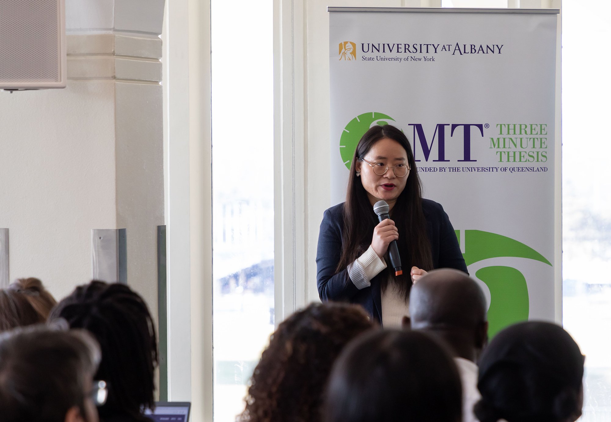 Jina Byeon, a doctoral student in curriculum and instruction, presents her findings at the 3-Minute Thesis competition.