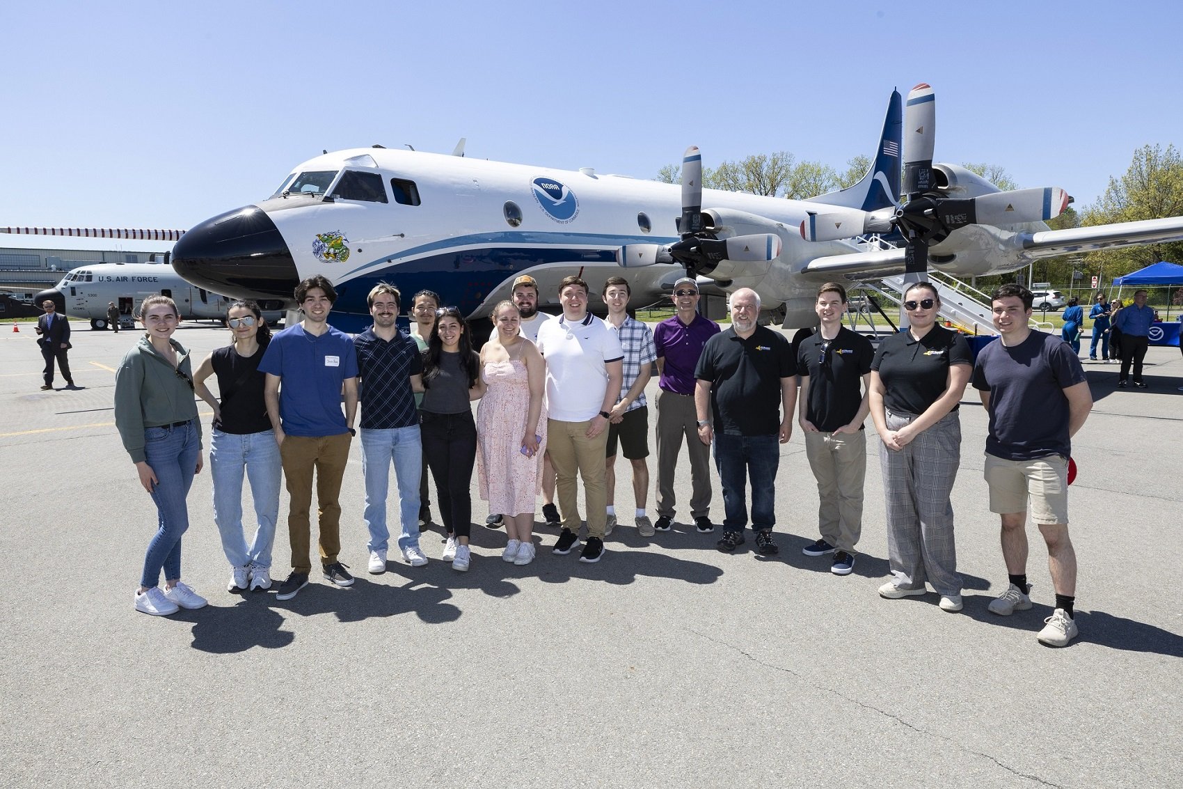UAlbany students, faculty and staff stand in front of the NOAA Hurricane Hunter.